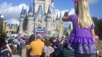 Madisyn on Paw Paws shoulders watching the show at the Enchanted Castle!