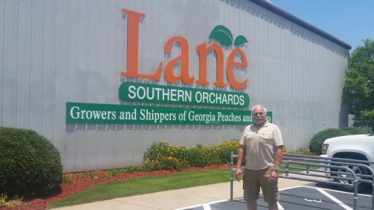 roy in front of lane southern orchards